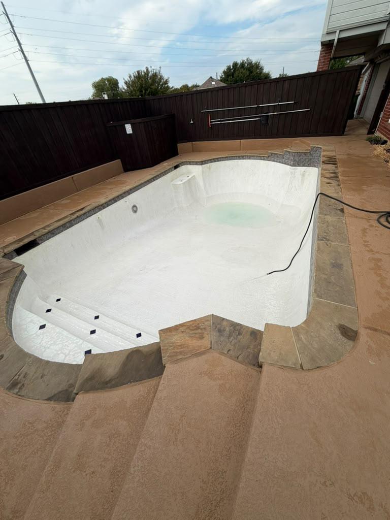 Clean white pool surface before refilling
